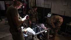 Participants in the Joint Emergency Medicine Exercise (JEMX-25) prepare to receive simulated casualties during the Joint Emergency Medicine Exercise (JEMX-25)