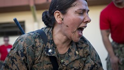 U.S. Navy Commander Flavia Soto, a participant of Operation Blue Horizon, performs tactical combat care on a manikin at MacDill Air Force Base, Florida