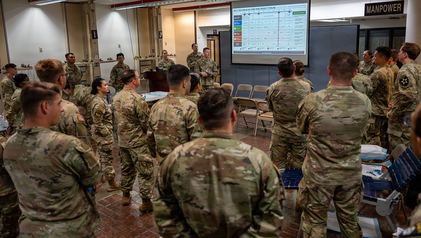 U.S. Air Force Maj. Thomas Oliver, 8th Operational Medical Readiness Squadron warrior medicine clinic flight commander, briefs medical personnel during the Joint Trauma System Valkyrie Role 3 Course