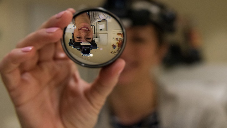 Dr. Courtney Humphrey, 633rd Aerospace Medicine Squadron optometrist, holds a lens used to look into a patient’s eye at Joint Base Langley-Eustis, Virginia, Jan. 27, 2020. Humphrey is one of three doctors in the Langley AFB optometry clinic, treating active duty personnel from all branches. (U.S. Air Force photo by Airman 1st Class Sarah Dowe)