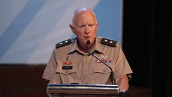 18th Theater Medical Commanding General Command Maj. Gen. E. Darrin Cox, gives an overview of the 12 exchanges in 10 locations U.S. Army, Oregon Army National Guard, and Oregon Air National Guard Soldiers are slated to compete alongside their People’s Army of Vietnam and Civilian partners during Pacific Friendship 2025 while addressing an audience at the namesake exchanges opening ceremony Sept. 9, 2025 in the Cinema and Cultural Center at Quang Tri, Vietnam. (U.S. Army photo by Sgt. 1st Class Timothy Hughes/Released)