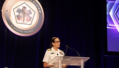 Capt. Franca Jones, commander, Naval Medical Research Command (NMRC), speaks to attendees at the plenary session for the 2025 Military Health Research Symposium