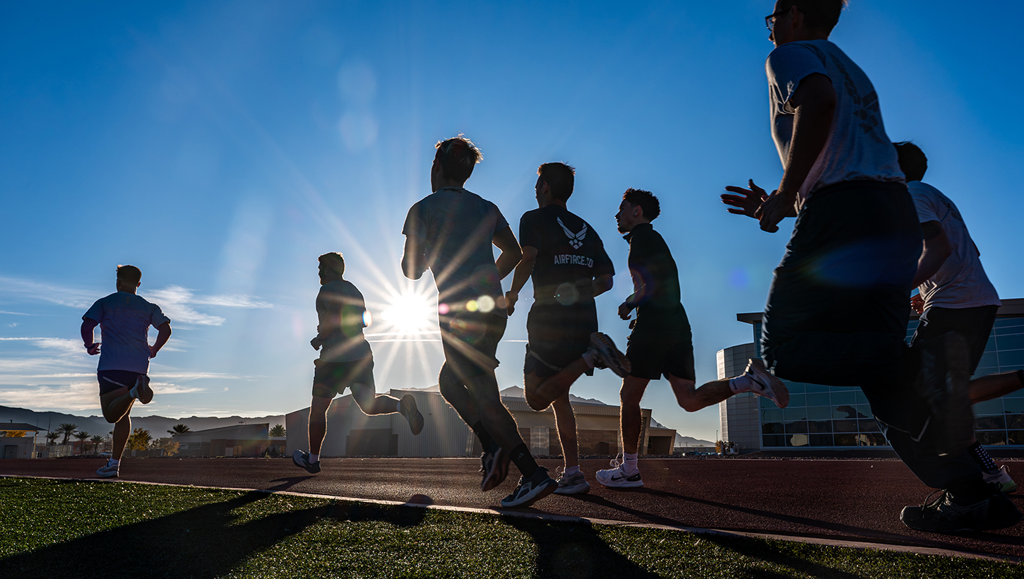 Military personnel running outside for a fitness test