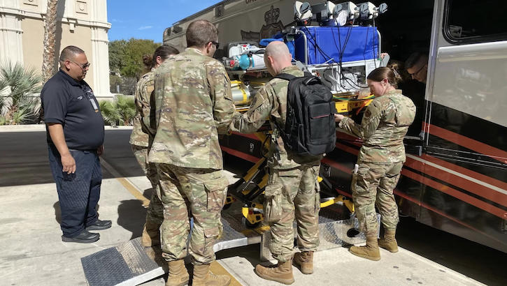 Army Maj. (Dr.) Christopher Stark (with backpack), a neonatology fellow at Walter Reed, joins with other military providers during training in military-specific transport for neonates at the Conference on Military Perinatal Research (COMPRA) in San Antonio in November. (Courtesy Photo)