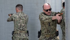 Hospital Corpsman 2nd Class Nicholas Moubarak, assigned to Expeditionary Resuscitative Surgical System (ERSS) Three, and Lt. Cmdr. Derrick O'Neal, assigned to the Expeditionary Medical Facility (EMF) Alpha, conduct close quarter combat (CQC) training