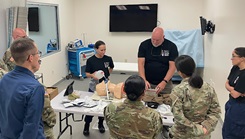 Instructors walk Tier 4 Provider TCCC students through a trauma skills station