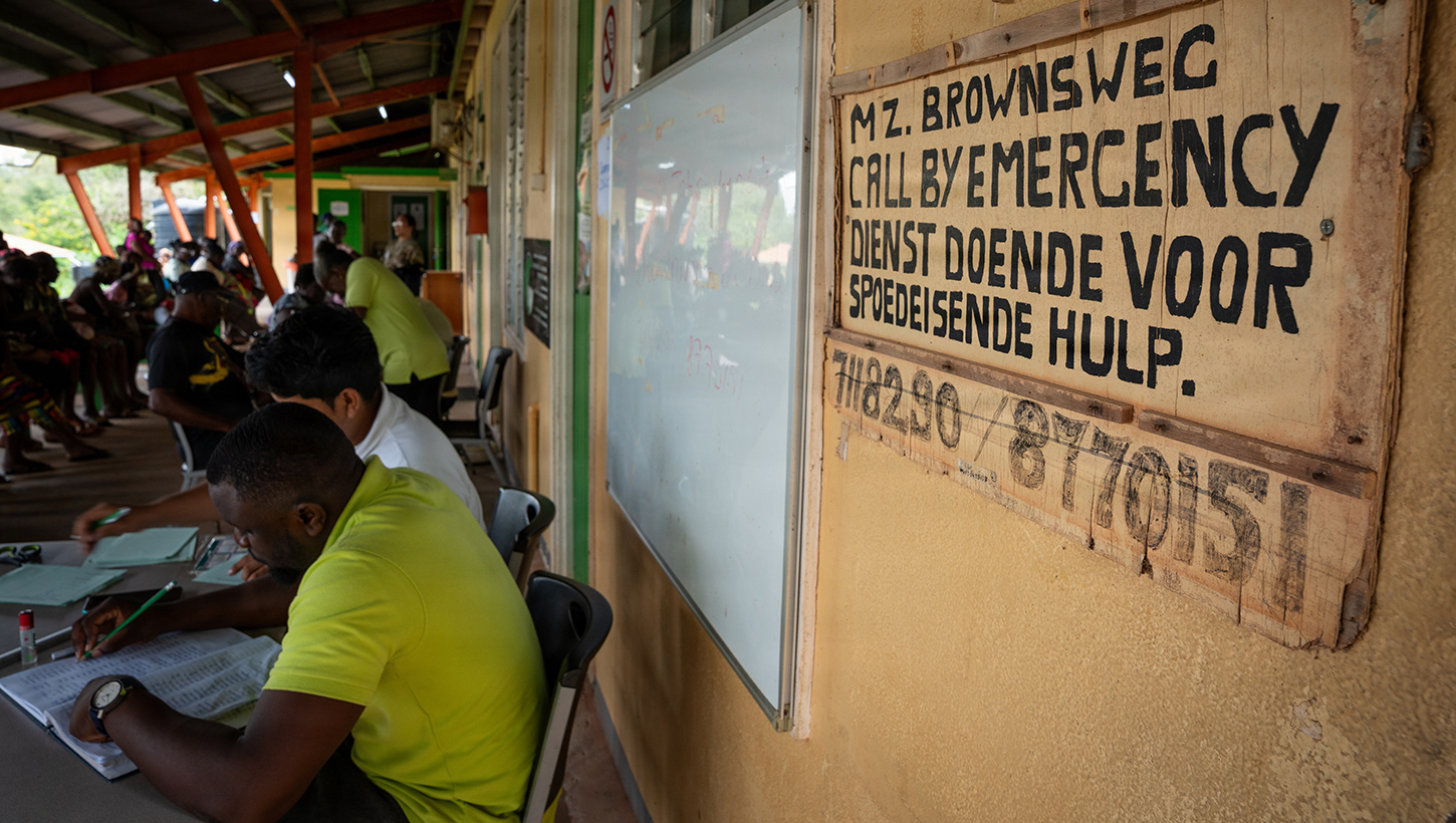 Surinamese patients wait to be seen during a Lesser Antilles Medical Assistance Team (LAMAT) 2026 mission