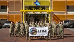 U.S. Air Force personnel pose for a photo outside the Owen King European Union hospital during the Lesser Antilles Medical Assistance Team (LAMAT) 2026 mission