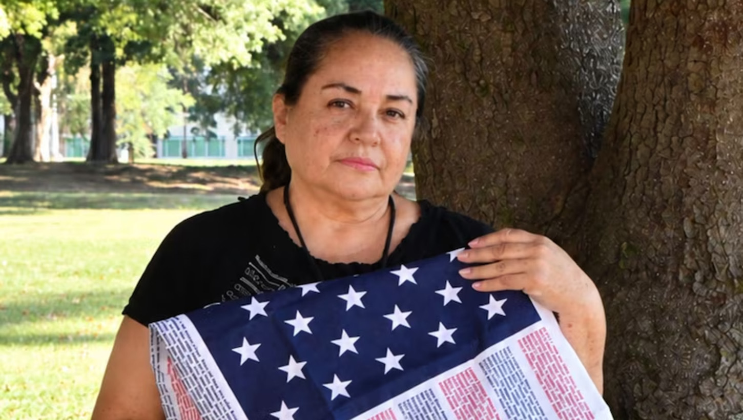 Sandra Nunez-Lopez holding Flag of Honor