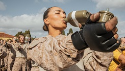 U.S. Marine Corps recruits with Golf Company, 2nd Recruit Training Battalion, hydrate prior to a Marine Corps Martial Arts Program techniques class