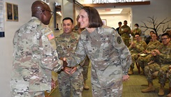 Brig. Gen. Deydre Teyhen recognized Maj. Harrison Sarpong, chief of pharmacy, for his excellence in health care at Brig. Gen. Crawford F. Sams Health Clinic