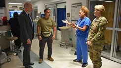 Dr. Stephen Ferrara, acting assistant secretary of Defense for Health Affairs, gives recognition to Staff Sgt. Richard Duran for his contributions to the paramedic orientation program