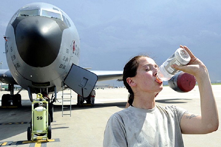 Generally our bodies are comprised of approximately 60 to 70 percent water. We need water for digestion, energy and oxygen transport, and temperature regulation. Senior Airman Johanna Magner, 22nd Aircraft Maintenance Squadron crew chief, drinks water on the flightline in front of a KC-135 Stratotanker. With rising temperatures during the summer months people are encouraged to drink more water to stay hydrated. (U.S. Air Force photo by Airman 1st Class Jenna K. Caldwell)