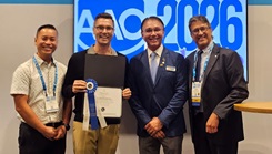 Navy Lt. Cmdr. (Dr.) Miles Pedersen, a resident in the Tri-Service Orthodontic Residency Program, takes top honors at the American Association of Orthodontics Annual Meeting. Pedersen, second from left, poses with Air Force Lt. Col. (Dr.) Duy Nguyen (left) and competition officials.