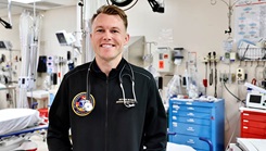 U.S. Navy Lt. Cmdr. Riley Hoyer, an emergency physician and department head of emergency medicine at Naval Hospital Twentynine Palms, California, stands inside the hospital’s emergency department