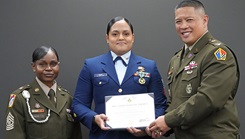 Command Sgt. Maj. Yveline Symonette, USMEPCOM senior enlisted advisor, and Col. Frankie Cochiaosue, USMEPCOM commander, present Petty Officer 2nd Class Kristy Fricks, Houston MEPS medical specialist, with a joint service commendation medal.