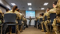 Photo of Chaplain giving word of the day to service members