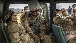 Medical students demonstrate tactical combat casualty care skills on another student casualty role player during a simulated improvised explosive device ambush scenario. Medical simulation training, like those offered during the Uniformed Services University’s medical field exercises, give students the opportunity to immerse themselves in realistic scenarios. (Photo by Tom Balfour/Uniformed Services University) 