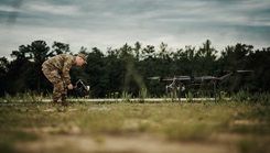 Army Sgt. Noe Cork, a paratrooper assigned to the Headquarters and Headquarters Battalion, 82nd Airborne Division, records footage of a tactical drone