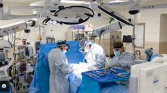 U.S. Navy Capt. (Dr.) Michael Cirivello, chief of Neurosurgery at Walter Reed National Military Medical Center, and his team perform a spinal fusion to alleviate a patient’s chronic back pain