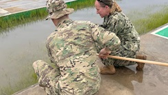Cmdr. Rebecca Pavlicek, Naval Medical Research Unit (NAMRU) EURAFCENT detachment director, collects samples from a water source as part of environmental health surveillance activities during exercise Flintlock 2026