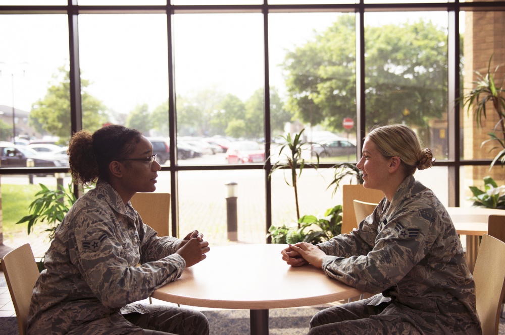 Mental health technicians assigned to the 48th Medical Group Mental Health Flight converse in the hospital reception area at Royal Air Force Lakenheath, England. The Mental Health Flight is one of many resources available to assist with depression and other mental health concerns. (U.S. Air Force photo/Airman 1st Class Shanice Williams-Jones)