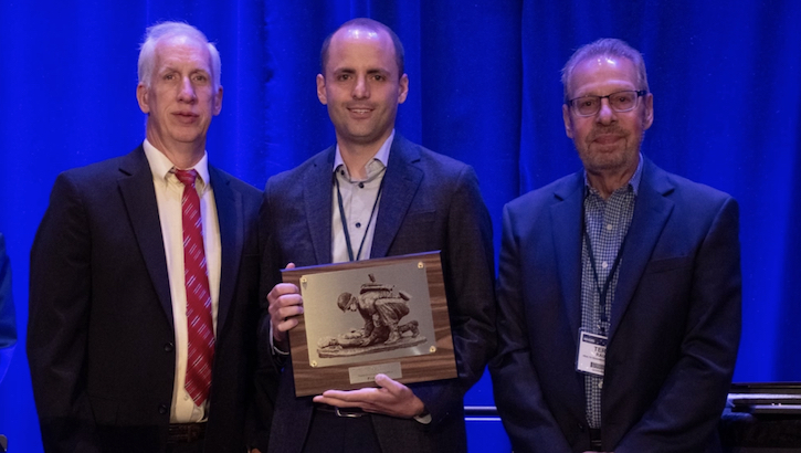 Image of Ian Stanley, with the department of emergency medicine at Anschutz Center for Combat Medicine and Battlefield, University of Colorado School of Medicine, receives first place in the 2023 Military Health System Research Symposium Young Investigator Competition for his presentation titled, “Lethal Means Safety Counseling Among Firearm-Owning U.S. National Guard Personnel: Hyperarousal Symptoms as a Moderator of Treatment Outcomes” at the 2023 MHSRS in Kissimmee, Florida, Aug. 17. (Photo: Robbie Hammer).