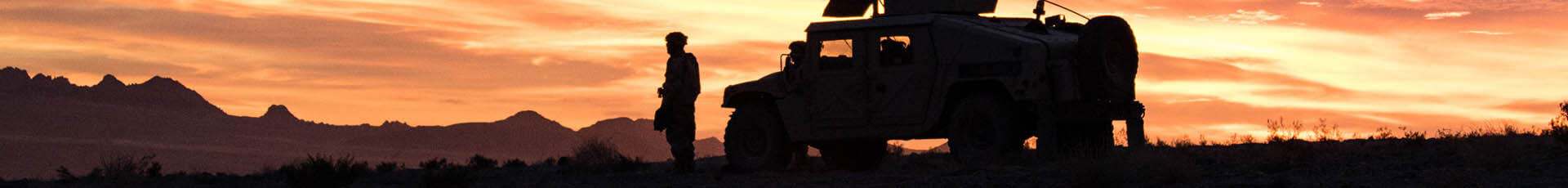A 1st Armored Brigade Combat Team, 1st Cavalry Division Soldier pulls guard while participating in a National Training Center rotation 18-02 at Fort Irwin, CA. Soldiers that participate in NTC rotations often get to see scenic sunrises over the Mohave Desert.