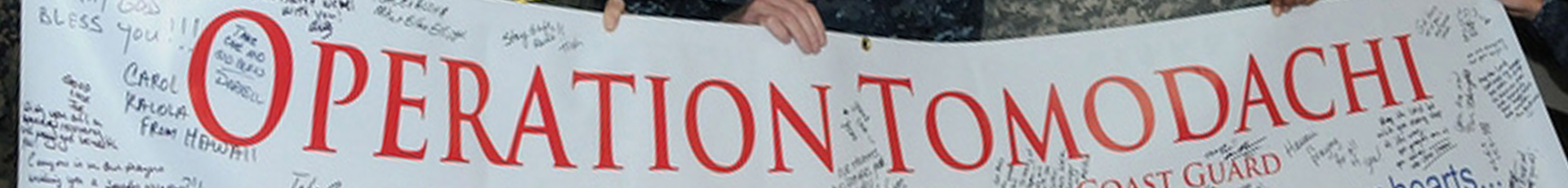 Navy Adm. Patrick M. Walsh, commander of U.S. Pacific Fleet, center, joins other senior U.S. military members supporting Operation Tomodachi in presenting Japanese Defense Minister Toshimi Kitazawa with a banner as he and senior Japanese leaders visit the aircraft carrier USS Ronald Reagan, April 4, 2011. Walsh credits the U.S. forward presence in the region with providing a rapid response -- whether for humanitarian assistance or to deter aggression. U.S. Navy photo by Petty Officer 3rd Class Kyle Carlstrom