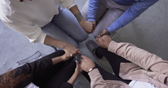 A group of people holding hands