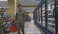Military personnel grocery shopping