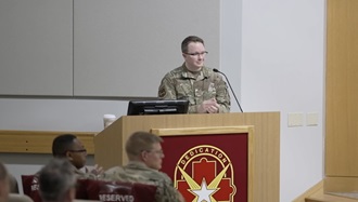 Link to Video: Military personnel at podium