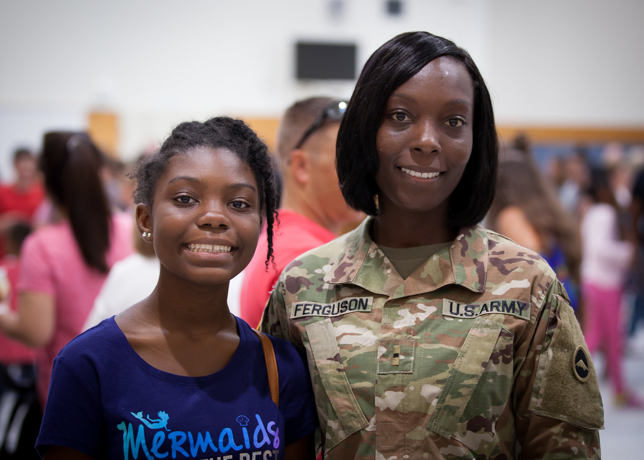 image of military mother and daughter smiling